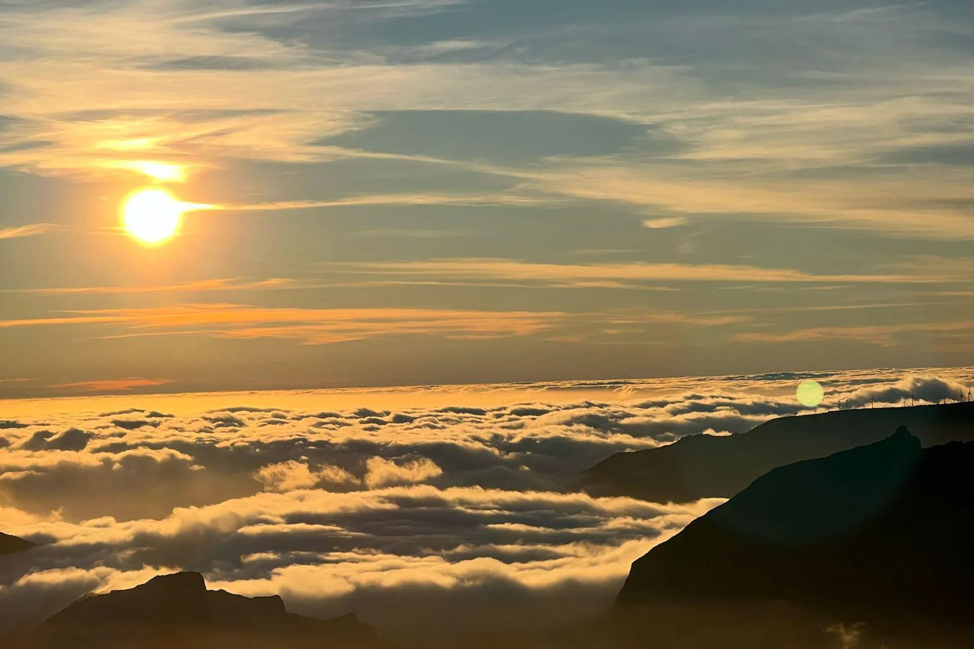 Sunrise above a sea of clouds from the Pico do Areeiro summit