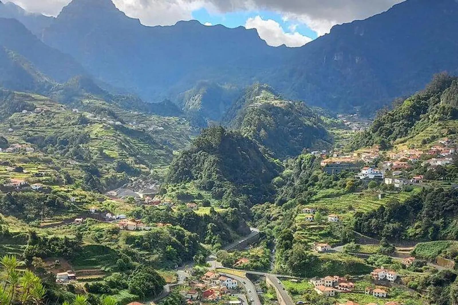 Terraced villages nestled in a lush green mountain valley
