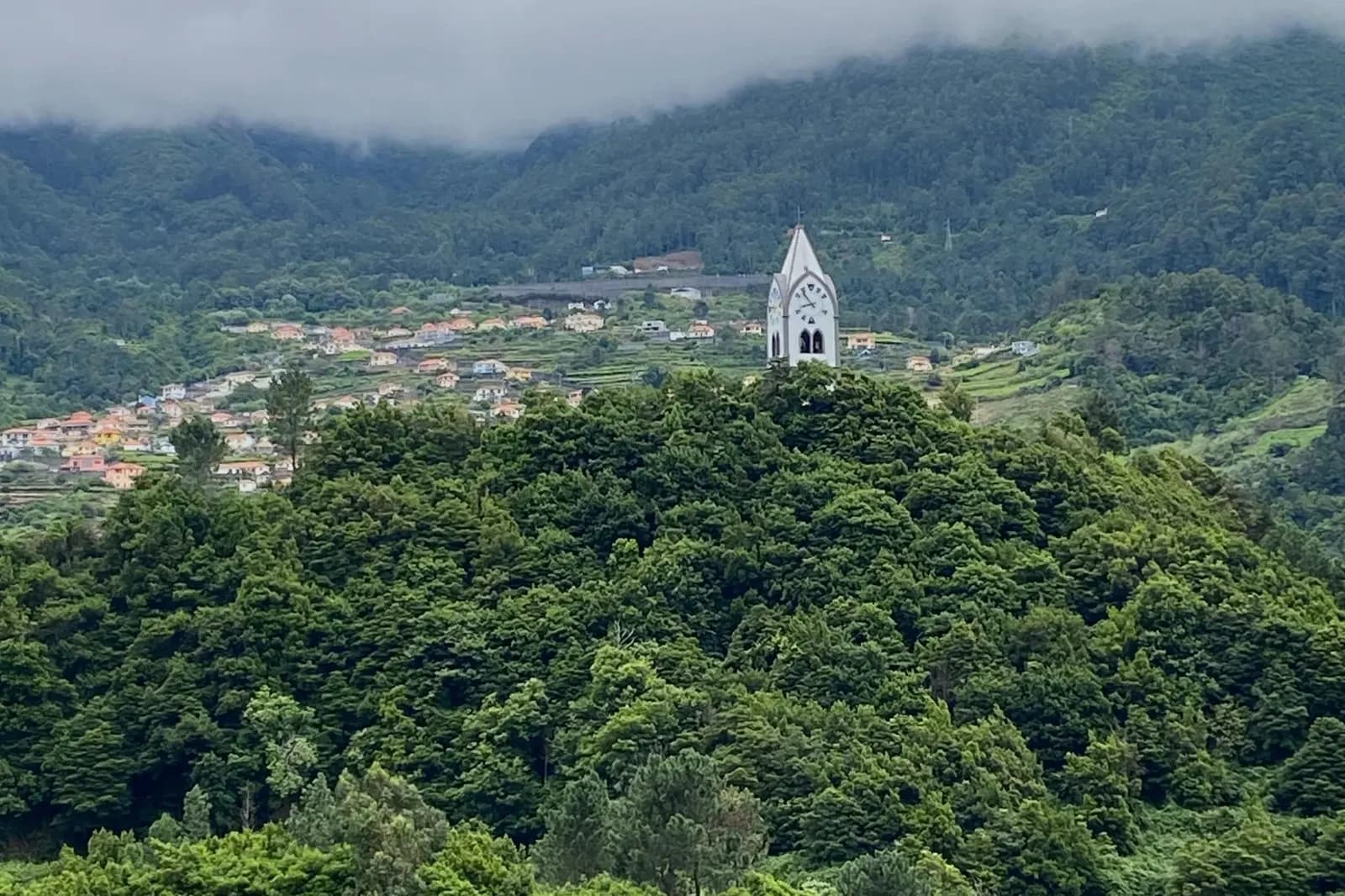 Hilltop chapel above the forested slopes of Seixal on the north coast